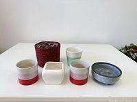 Front view of all six planters on table