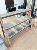 Front angled view showing full shelving unit and three shelves