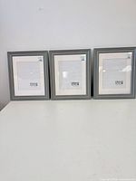 Front view of three identical grey/silver Urban Supply frames