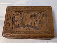 Top view of carved wooden box closed