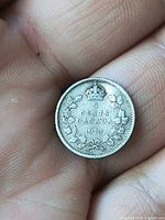 Reverse of coin showing 5 CENTS CANADA 1913 with crown and wreath