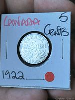 Reverse of 1922 Canada five-cent coin in flip