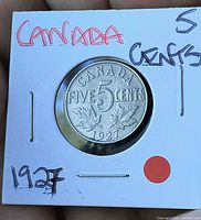 Obverse showing denomination CANADA FIVE CENTS 1927 in holder