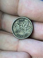 Reverse of 1937 Canada 1 Cent showing maple leaves, denomination, date