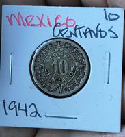 Obverse of 1942 10 centavos coin in holder