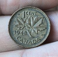 Reverse of 1948 Canadian 1 cent with maple leaves and date