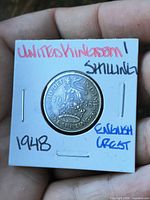 Obverse of 1948 one shilling coin in 2×2 flip showing English crest side