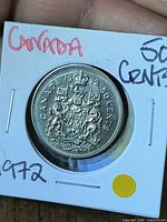 Reverse showing Canadian Coat of Arms and denomination