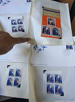 Overview showing album page with 10+5¢ block, souvenir card, FDCs