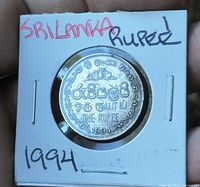 Reverse side of 1994 Sri Lanka one rupee coin showing denomination and date