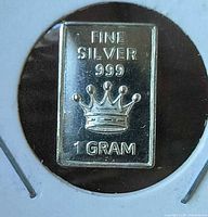 Obverse of 1-gram silver bar showing crown, purity and weight