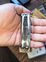 Harmonica front view showing Yamaha branding and scrollwork
