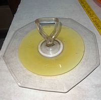Top view of clear and yellow octagonal glass platter with handle