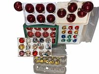 Overview of multiple trays and boxes of glass ornaments