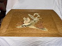 Top view of tray showing swan lithograph and oak-grain surface