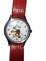 Close view of Lorus Mickey Mouse watch face and red strap