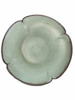 Front view of plate showing aqua glaze and four-lobed rim