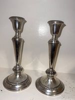 Front view of both sterling candlesticks assembled