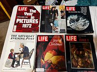 All six magazines laid out showing covers and condition