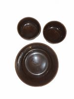 Top view showing three Bauer brown bowls, size comparison