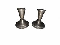 Front view of both sterling silver weighted candlesticks