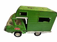 Side view showing green pressed-steel camper, white trim, Tonka logo, wheel condition