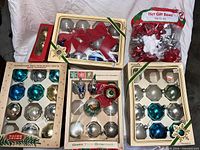 All boxes of ornaments and bag of bows overview