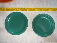 Front view of both teal plates to show color and condition