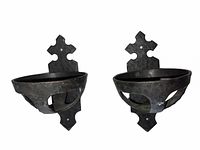 Front view showing both wrought iron sconces