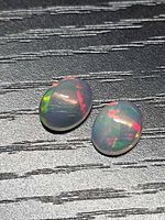 Top view of both opals showing multicolored play of color
