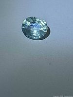 Front view of faceted aquamarine on neutral background