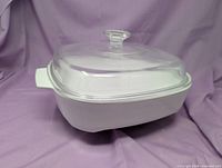 side view of ceramic dish with glass lid