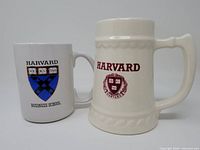 Front view of Harvard tankard and Harvard Business School mug