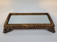 Top view showing full tray, mirrored surface and ornate frame