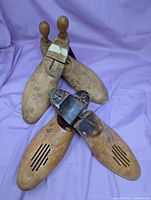 All four wooden shoe trees, two styles displayed