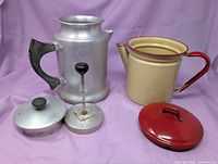 Aluminum percolator with detached lid and percolator stem, cream enamel pot with red handle and lid