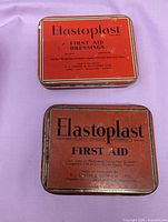 Two Elastoplast tins overview