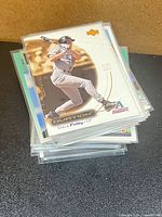 stack of sleeved baseball cards, top card Steve Finley Upper Deck