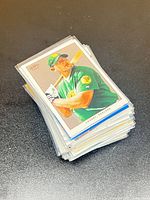 stack of sleeved baseball cards showing Bobby Crosby Topps card on top
