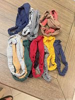 Ten assorted ribbed fabric headbands laid out