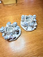 Two plaster snowman tealight holders top view