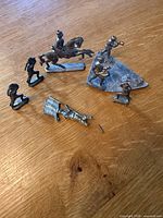 Group of all figures spread on wood surface