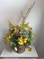 Full view of silk flower arrangement showing size and planter