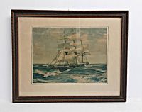 Front view of framed lithograph showing sailing ship artwork, mat and frame