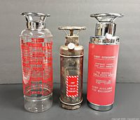 Front view of all three fire extinguisher decanters