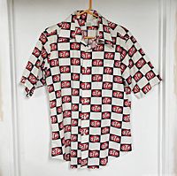 Front view of STP pattern short-sleeve shirt hanging