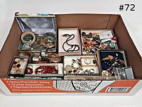 overview of assorted jewelry in box