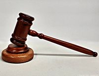 side view of wooden gavel resting on block