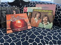 Front view of six LPs on couch