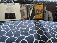 Front view of all five LP covers displayed